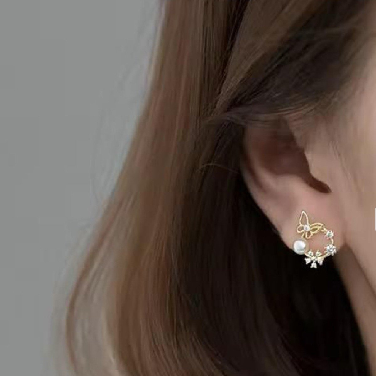 Gold-Plated Artificial Stones & Pearls Studded Butterfly Wreath Studs